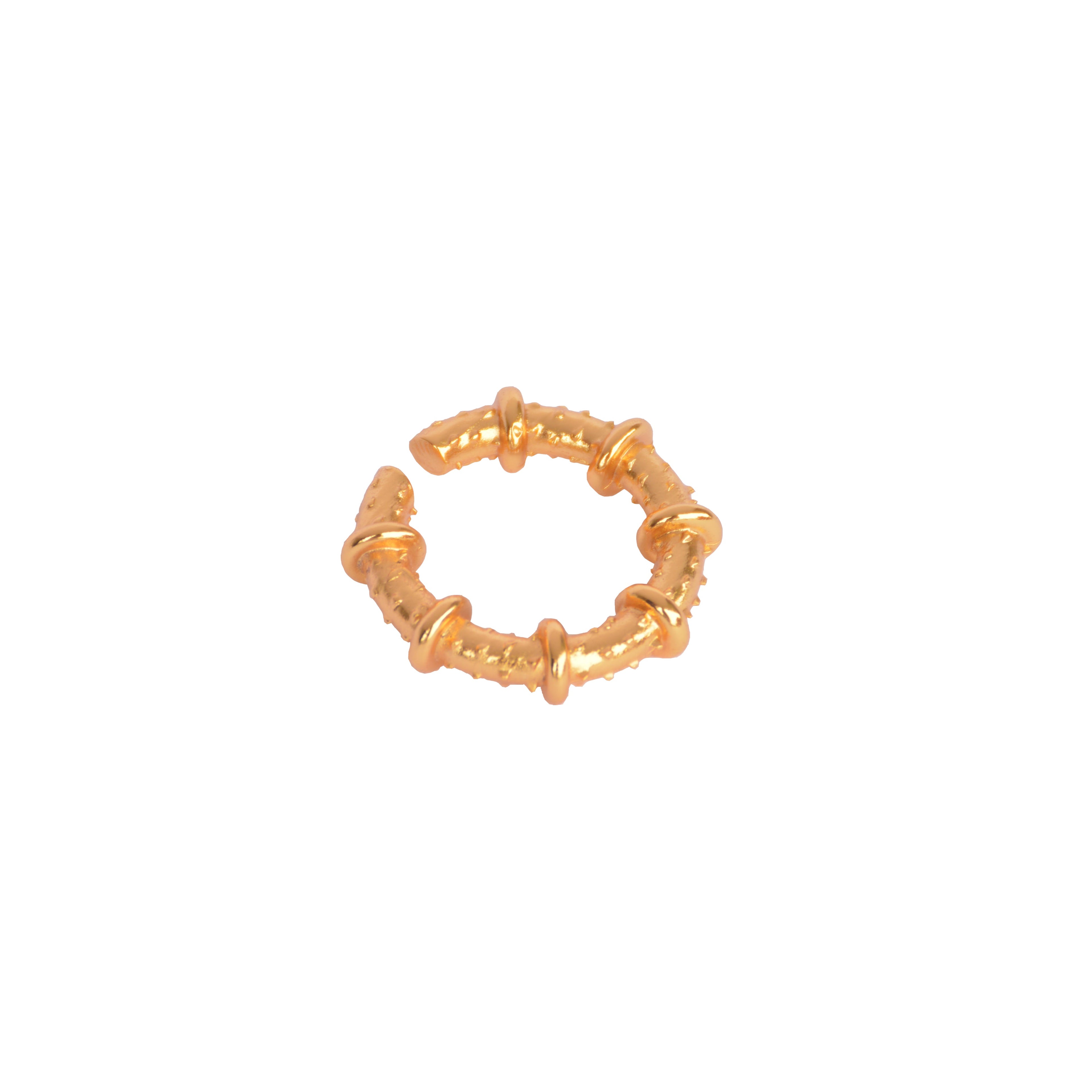 Earcuff maximalista a presión en bronce con baño de oro de 24K.