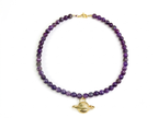 Collar saturno gold bronce baño de oro 24K.