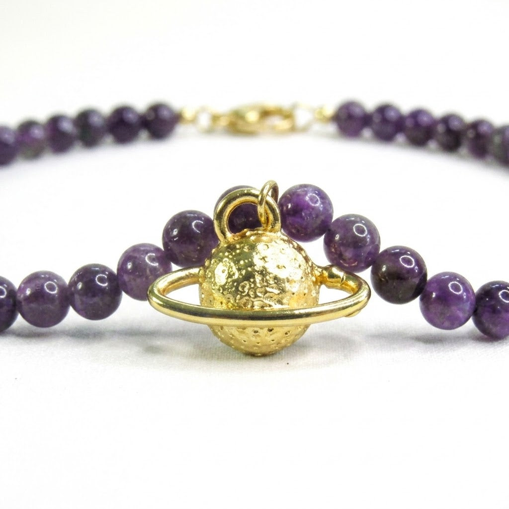 Collar saturno gold bronce baño de oro 24K.