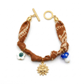 Pulsera Boho Textil Multicharm tejida a mano con dijes místicos