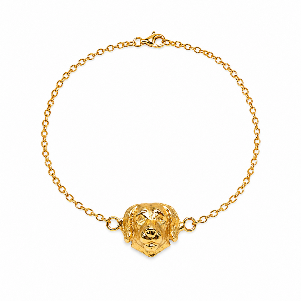 Pulsera de eslabones en bronce con baño de oro de 24K y dije de perro Golden de Polen wear.
