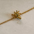 Pulsera con dije de jirafa en baño de oro de 24K de Polen wear